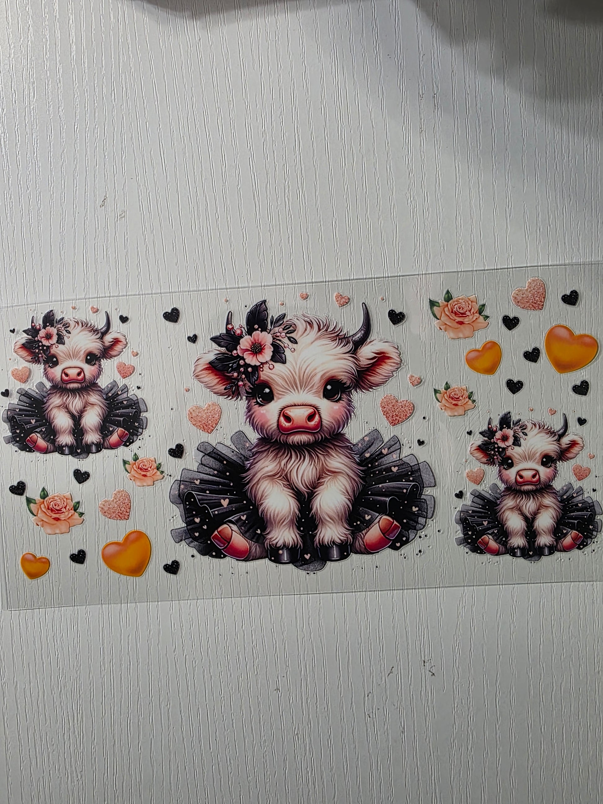 Cute cow w/ orange and black hearts