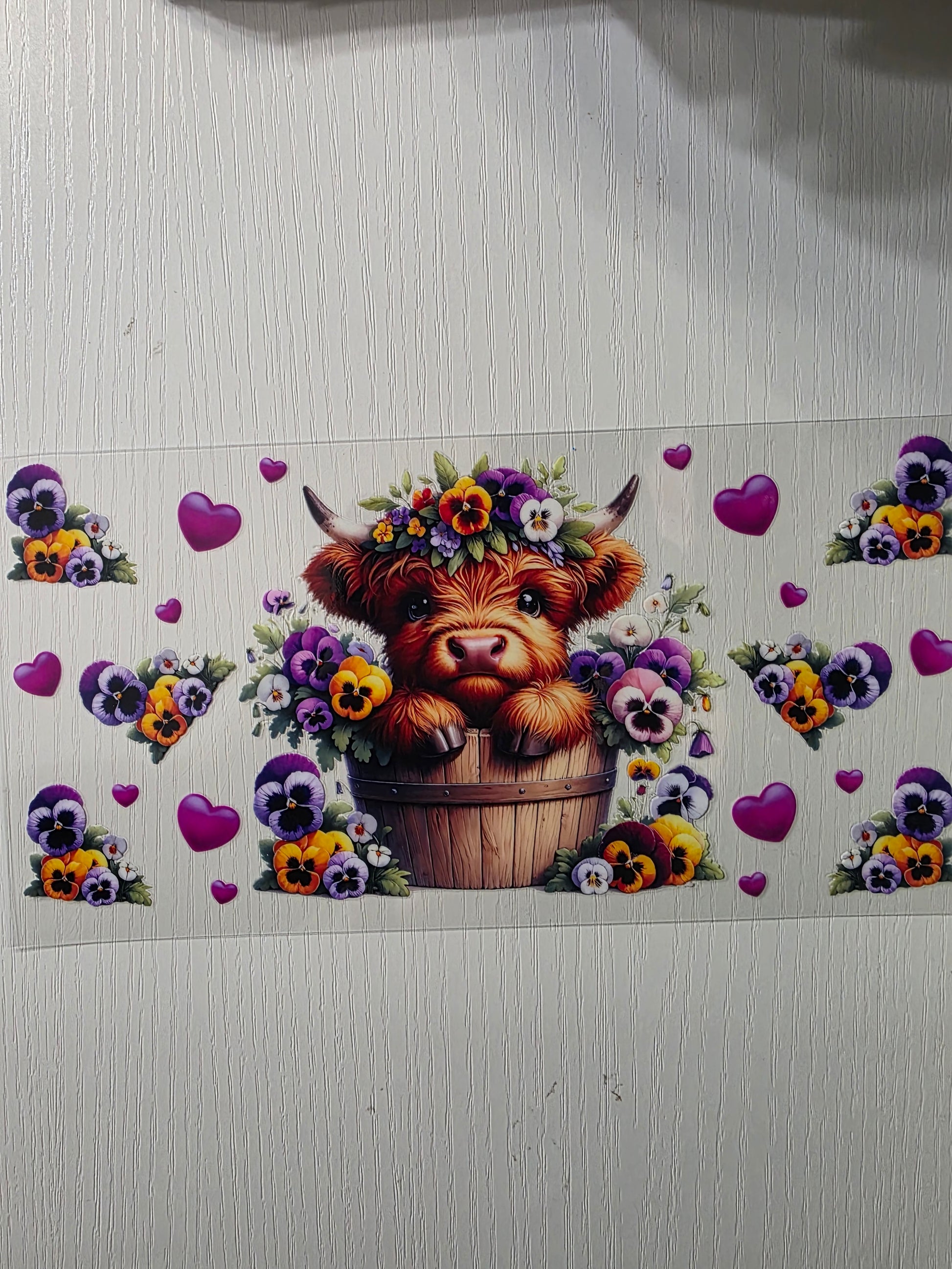 Cute cow in flower basket