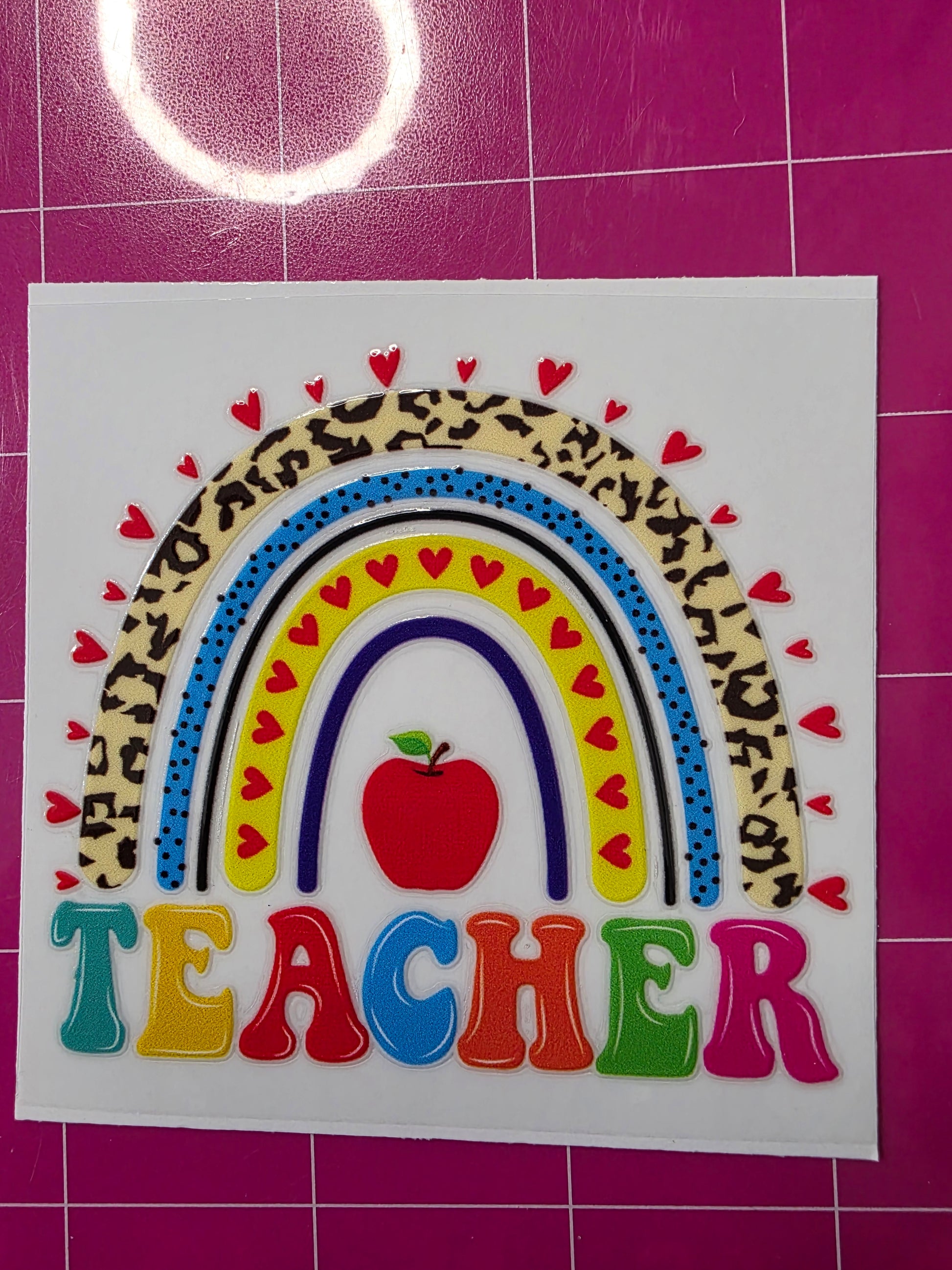 Teacher and rainbow with apple