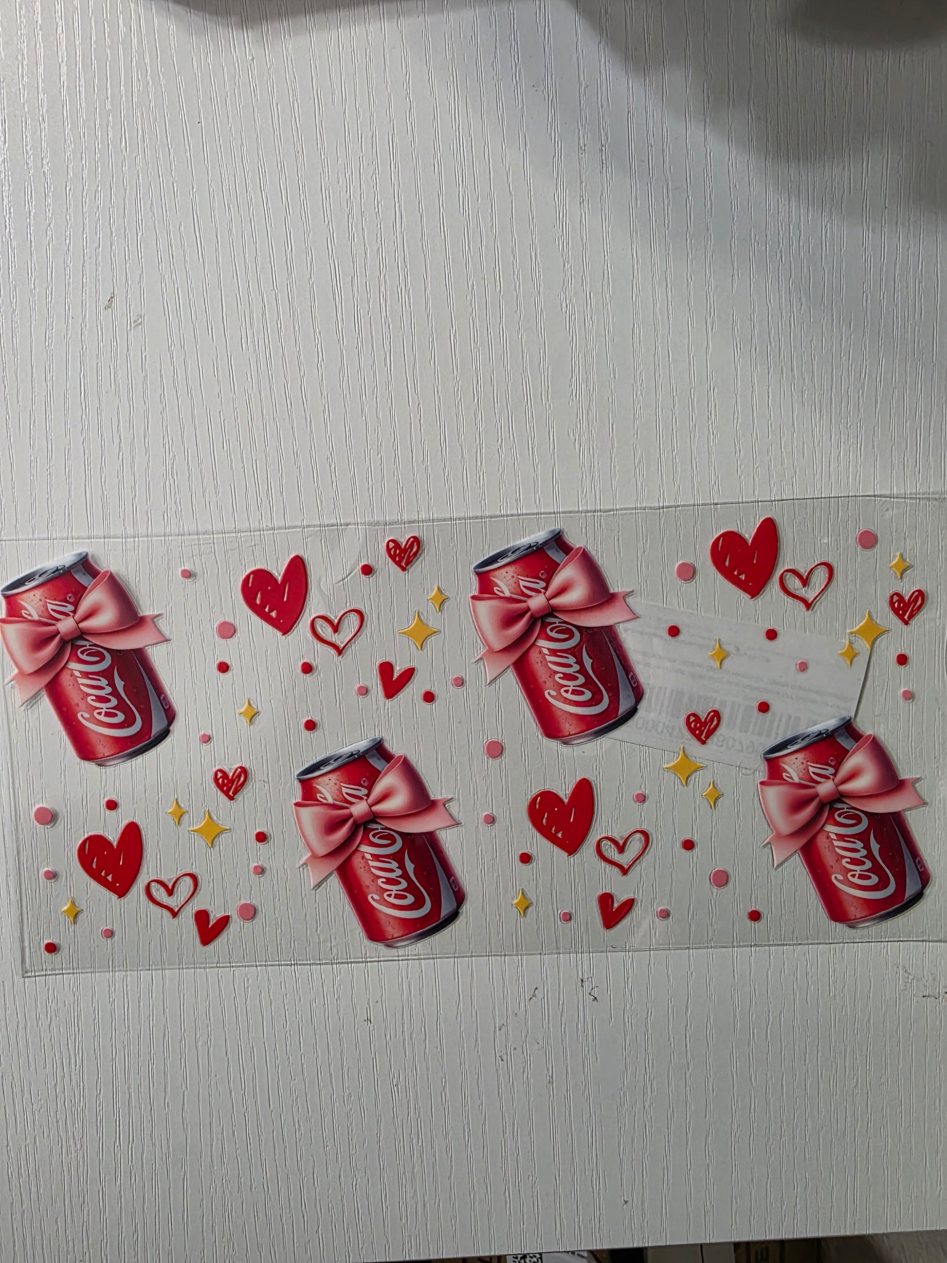 Coke cola cans with pink bows