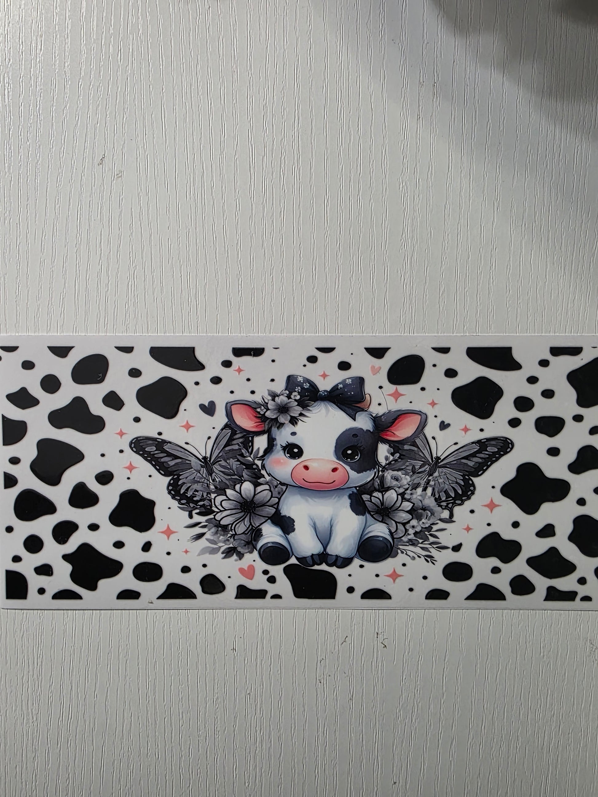 Black,grey, & white butterfly cow