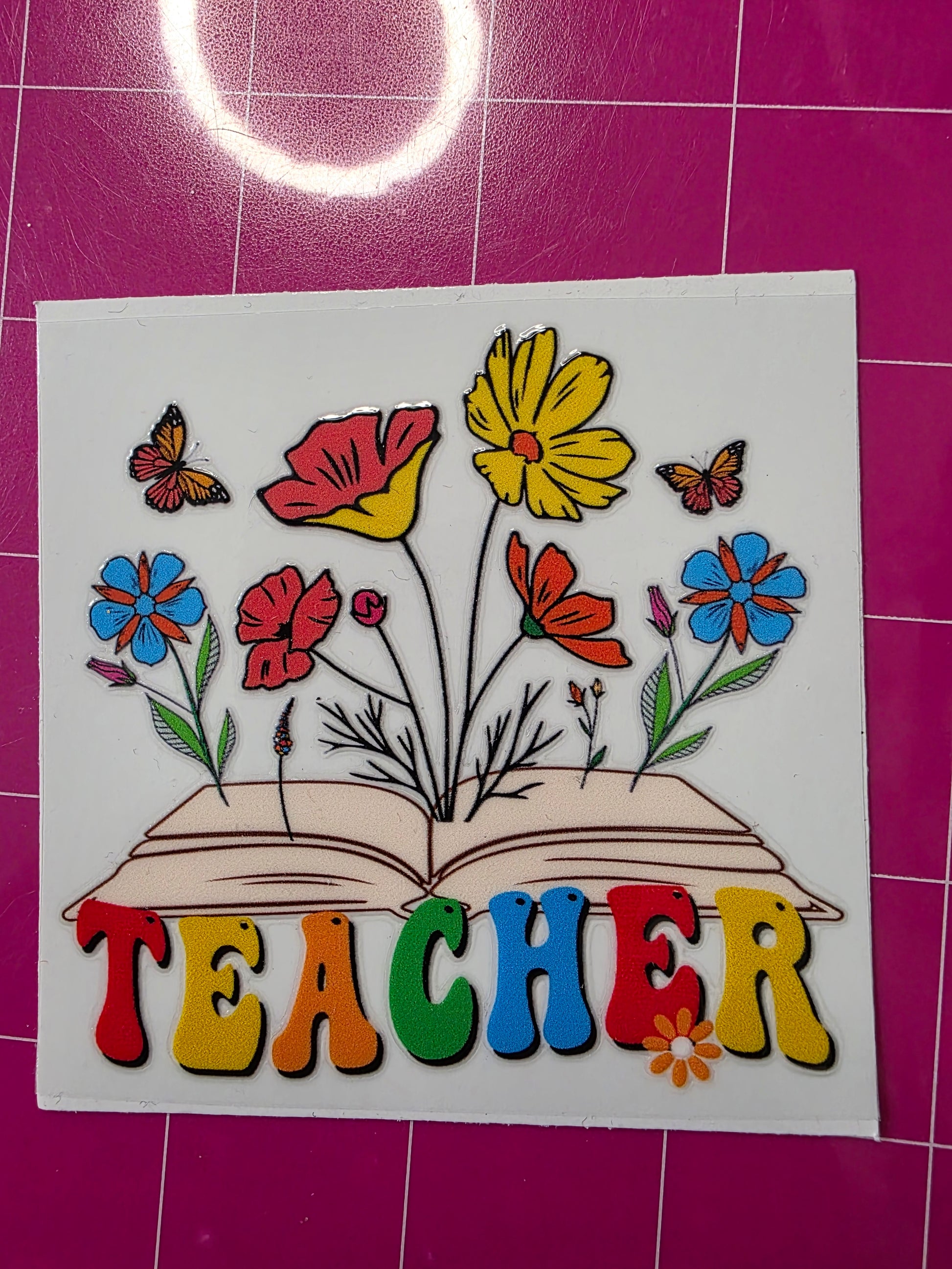 Teacher with book & flowers